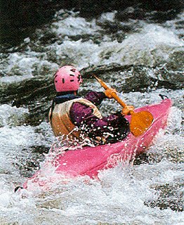 Kayaker navigates a river.