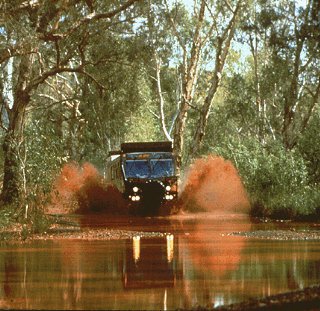 The Unimog fords a river.