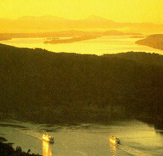 Ferries ripple the waters between islands.