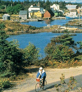A biker leaves a village in Nova Scotia.