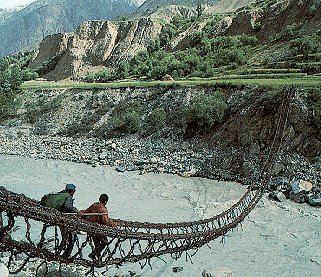 Crossing a river on a rope bridge in Pakistan.