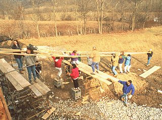 Volunteers work together to build a home.