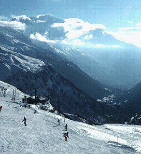 Skiers dot the Alpine slopes.