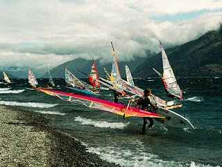 Windsurfers on New Zealand's coast.