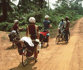 Bicycling along the rural road in Africa.