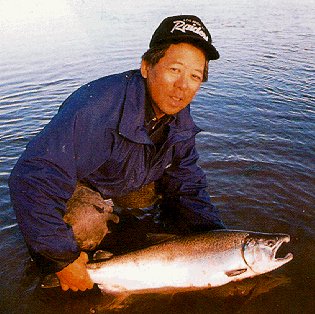 A successful fisherman and his salmon.