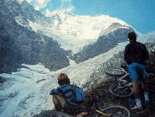 Bikers pause to view Glacier de Bionnassay.