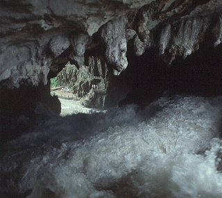 In the mouth of a cave in Guizhou Province.