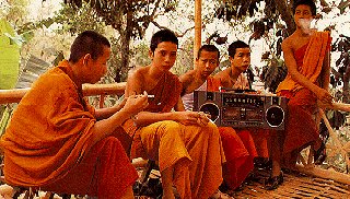 Thai monks have a smoke and enjoy music.