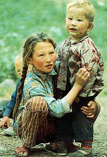 A Kazak brother and sister in Xianjiang, China.