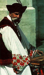 A street musician in Hungarian costume.