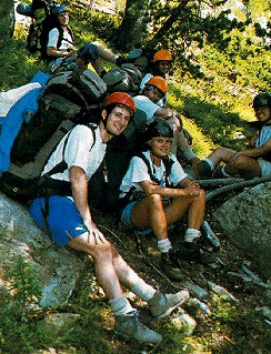 Taking a rest from backpacking in the woods.