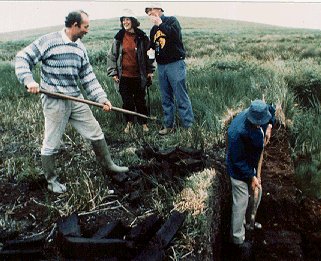 Cutting turf in an Irish peat bog.