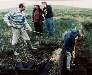 Cutting turf in an Irish peat bog.