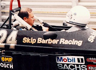 A student straps himself into his Formula Ford.