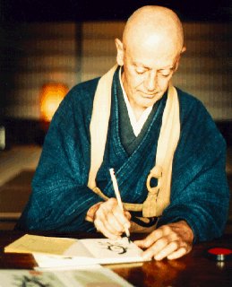 A Zen calligrapher composes characters.
