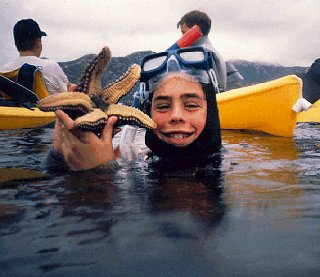 A young diver surfaces with a discovery.